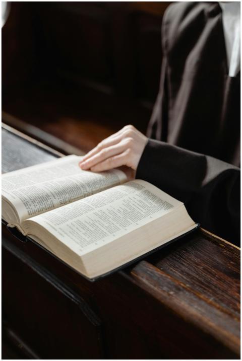 A nun reading a holy book inside a church, embraci