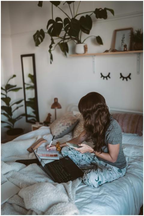 Woman enjoying remote work from home with laptop i