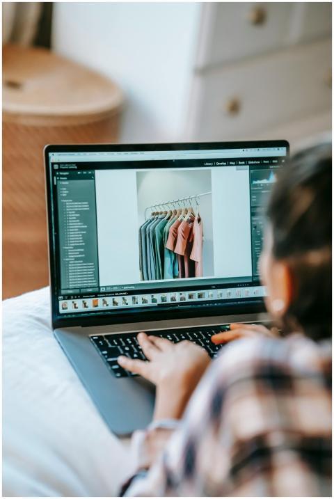 Back view of crop unrecognizable female remote wor