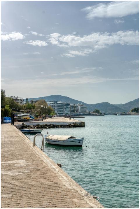 Discover the serene harbor of Chalkida, Greece, wi