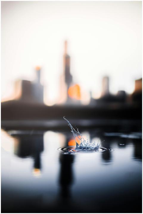 A captivating view of a water splash with a blurre