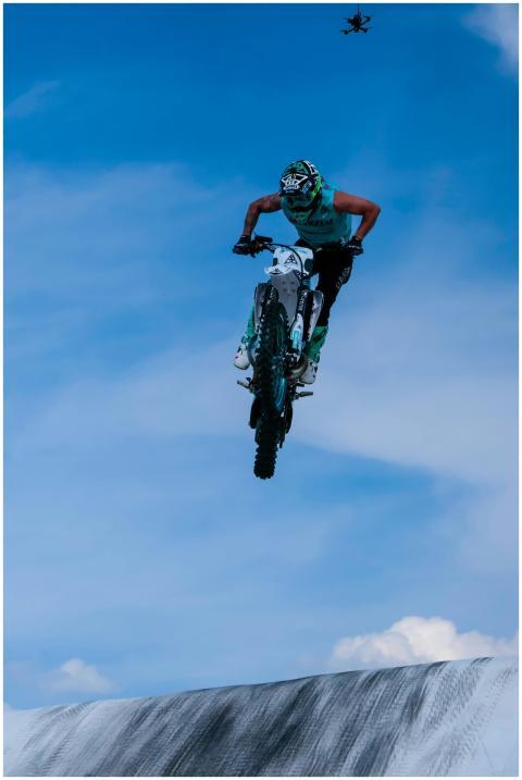 Thrilling motocross stunt in midair, showcasing sk