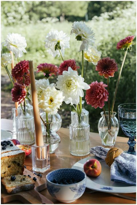 Charming outdoor breakfast table with fresh flower