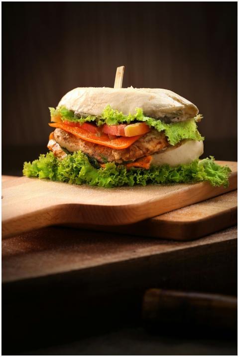 Delicious gourmet burger layered with fresh vegeta