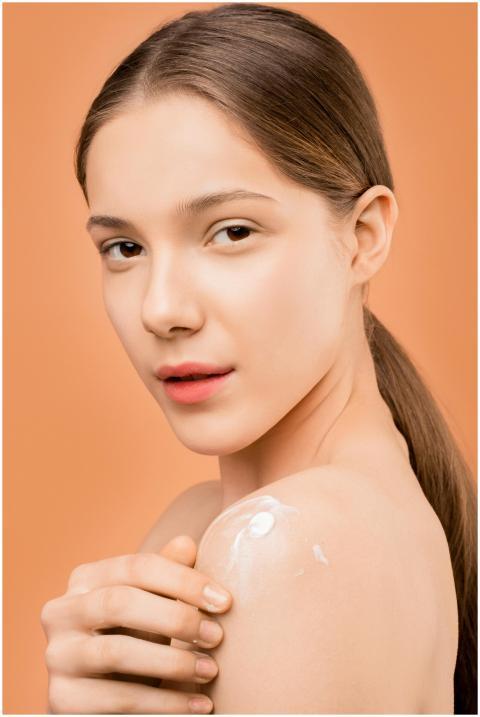 Young woman applies moisturizer on shoulder, set a