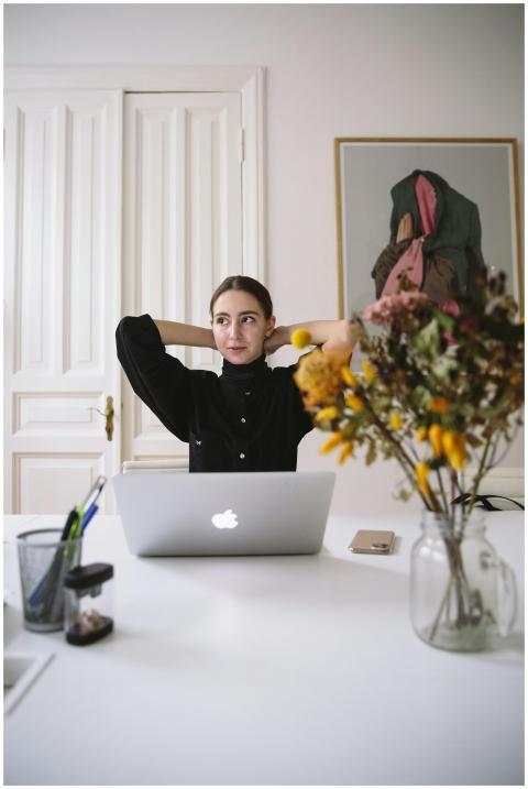 Relaxed woman in a modern office environment worki