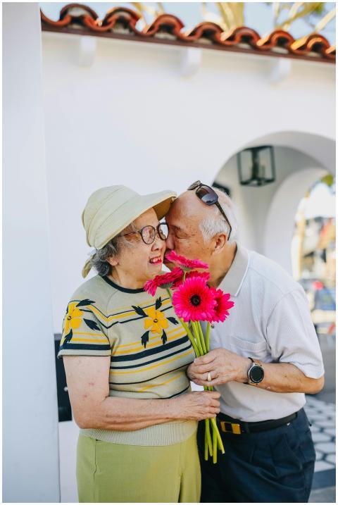 A loving elderly couple shares a tender moment out