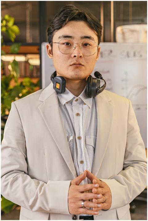Businessman in office with headset and eyeglasses,