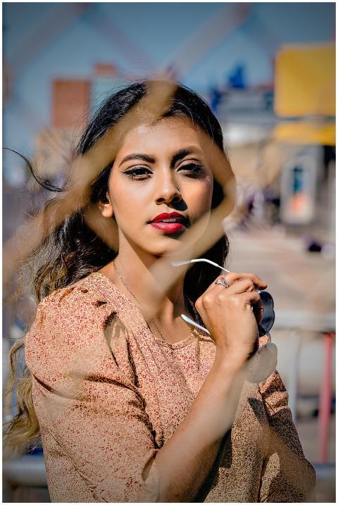 Portrait of a fashionable woman outdoors holding s