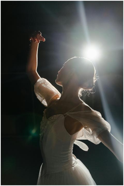 Silhouette of a ballet dancer in a white costume g