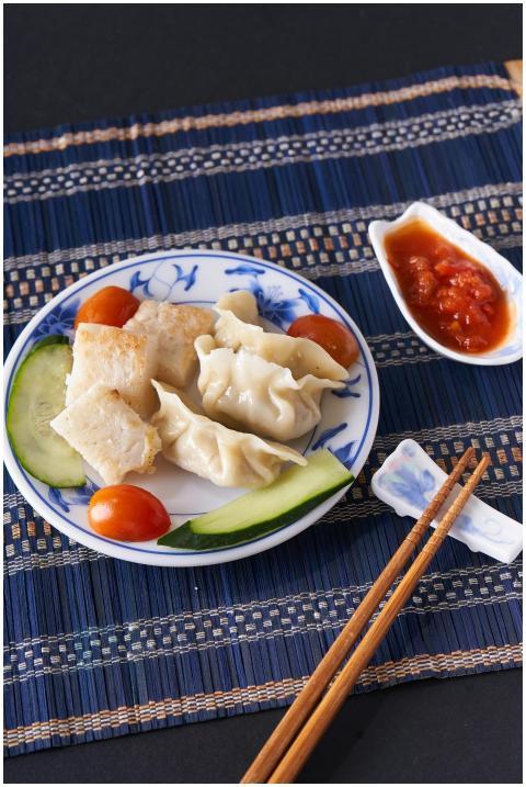 Delicious Asian dumplings served with vegetables a