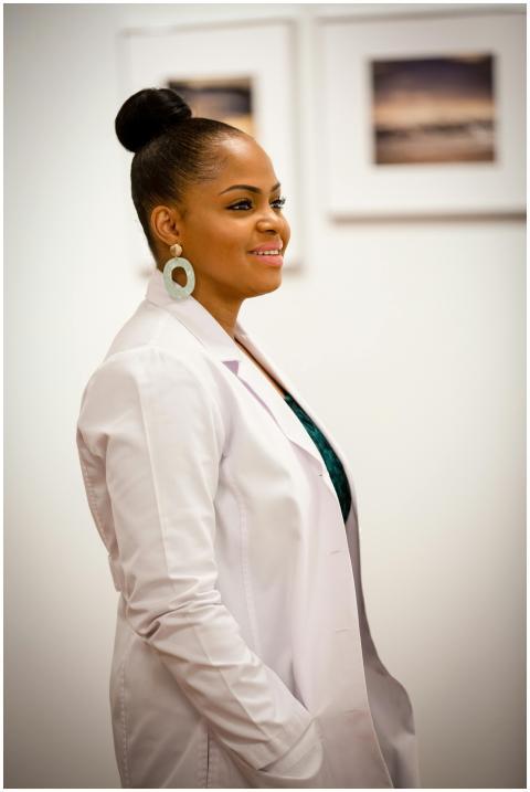 Portrait of a smiling female doctor in a white coa