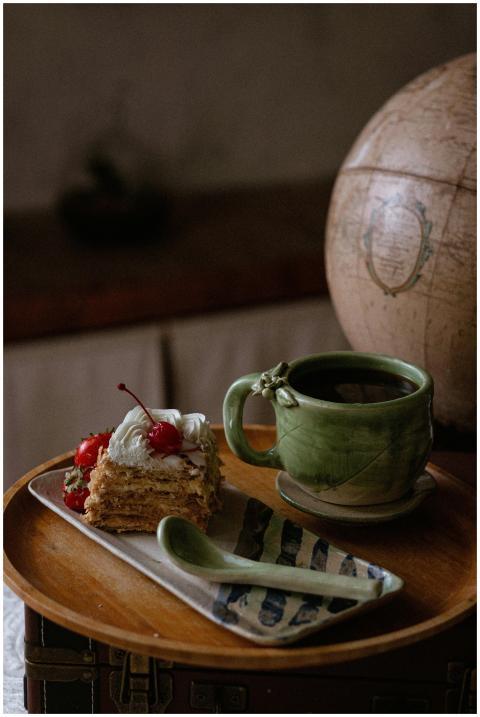 Mexican artisan ceramic mug and cake on wooden tra
