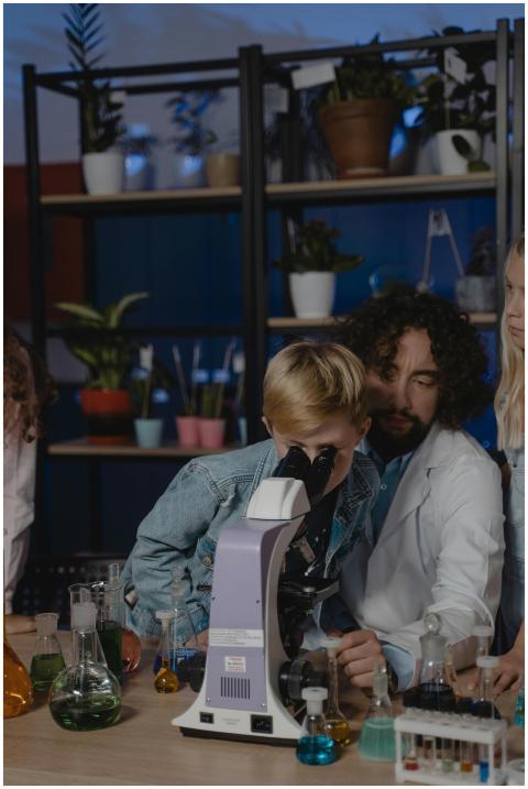 Students exploring science with a microscope and l