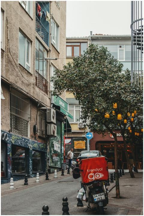 Vibrant urban street with a parked delivery motorc