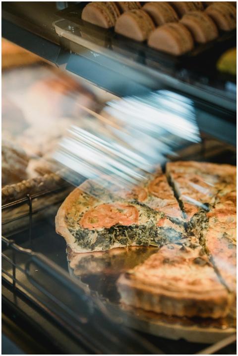 Freshly baked spinach tart in a bakery display, te