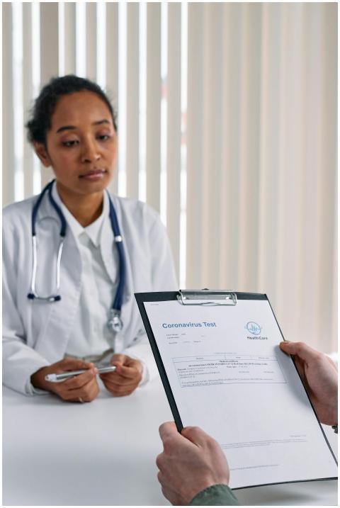 A doctor discusses coronavirus test results with a