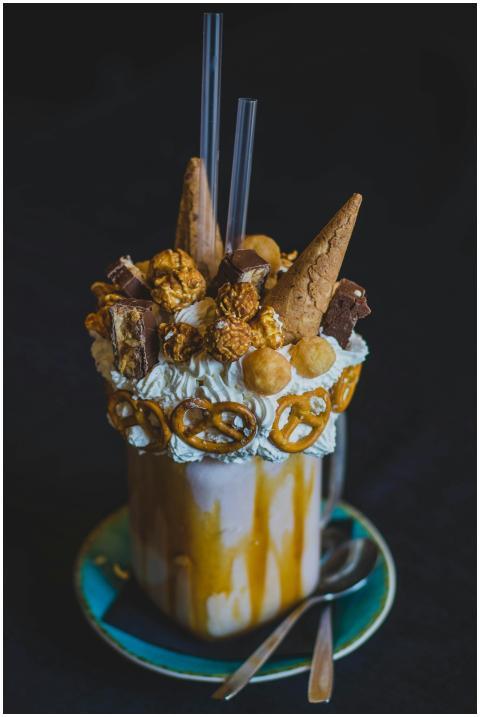 Luxurious milkshake with caramel, pretzels, popcor