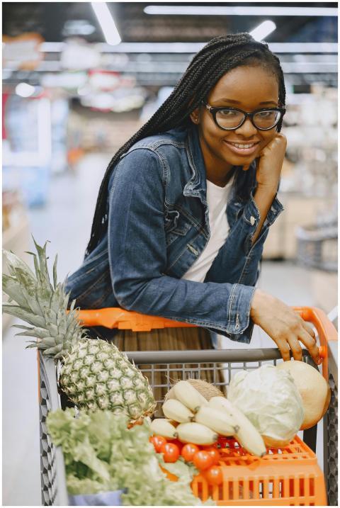 Young woman smiles while shopping in a supermarket