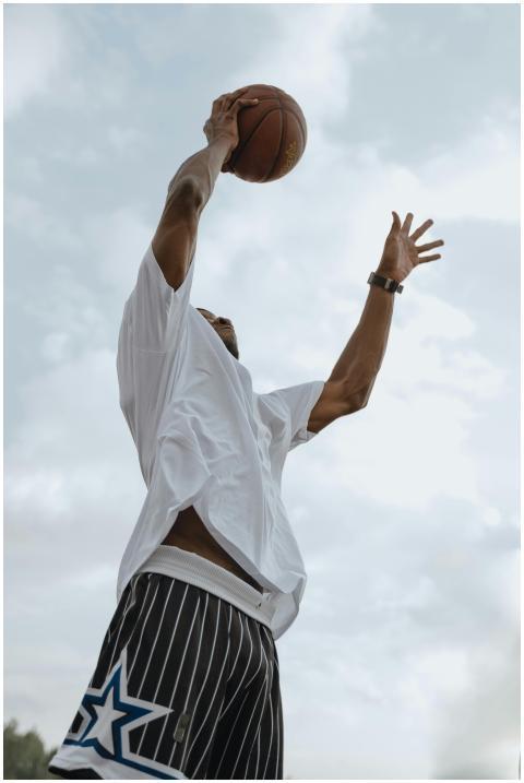 Athlete in action with a basketball, captured in a