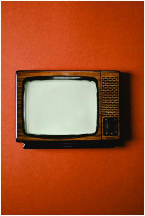 Retro television set with a wooden finish on a viv