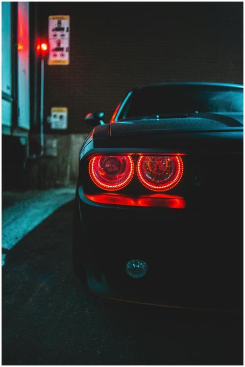 Close-up of a luxury sports car with glowing taill