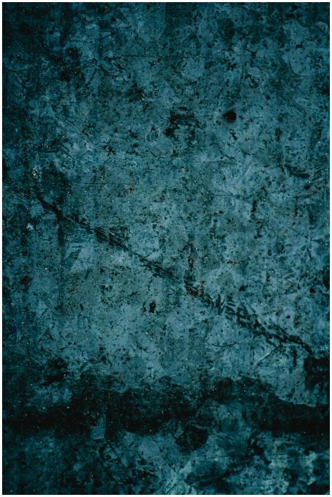 A detailed vintage grunge texture with dark tones,