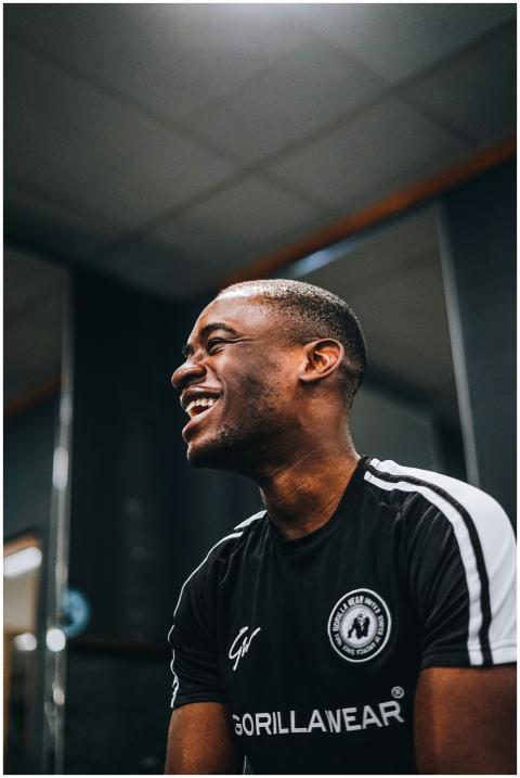 Portrait of a smiling man in a gym environment, we