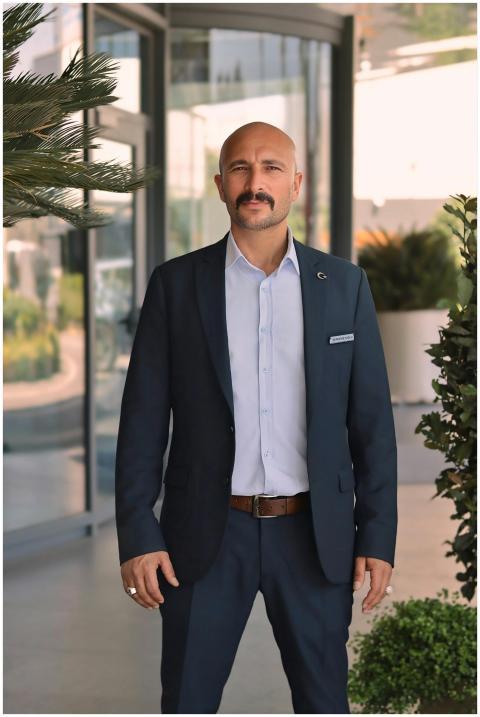 Confident businessman in a suit standing in front