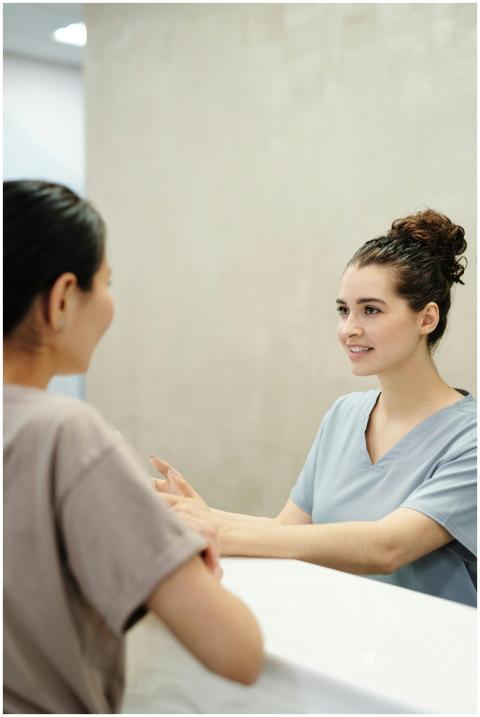 Nurse in conversation with patient at a medical re