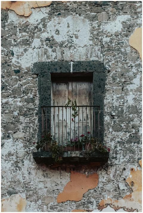 Close-up of an aged stone facade in San Miguel de