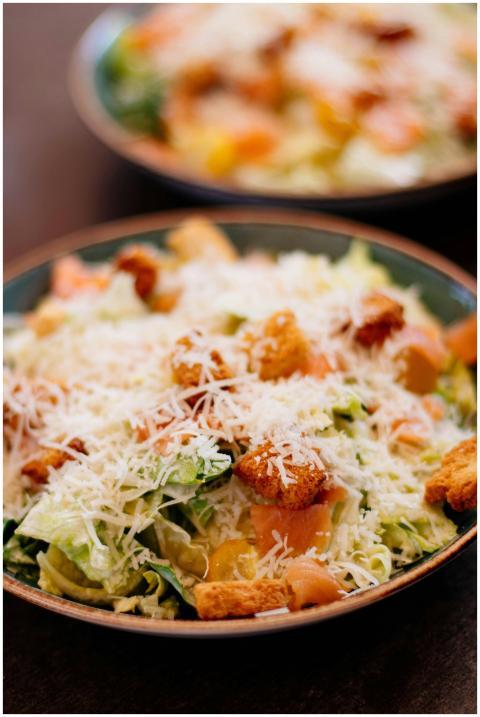 A mouth-watering Caesar salad topped with shredded