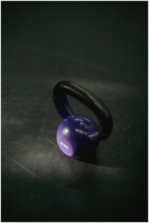 From above of single violet kettlebell with handle