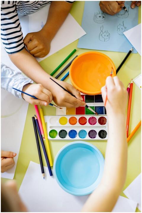 Kids enjoying watercolor painting, enhancing creat