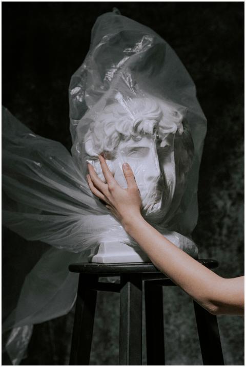 A gypsum sculpture wrapped in plastic, symbolizing