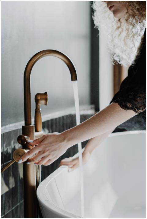 Elegant bathroom scene with a focus on gold faucet