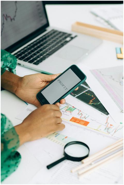 Close-up of a woman using a smartphone to analyze
