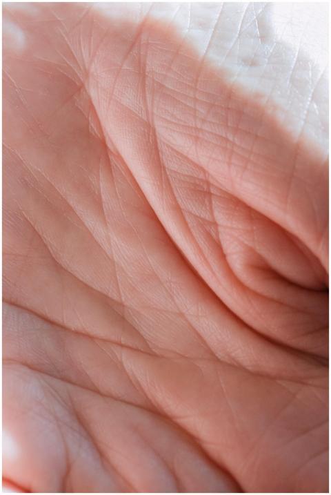 Detailed close-up of a human hand highlighting ski
