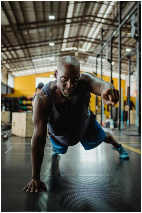 Muscular man demonstrating strength with a one-arm