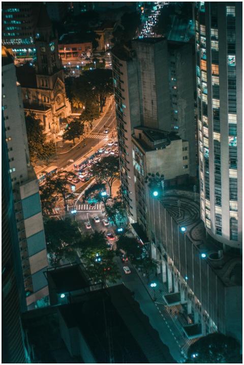 A dramatic aerial view of a city with illuminated