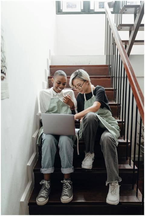 Full body of positive young diverse female friends