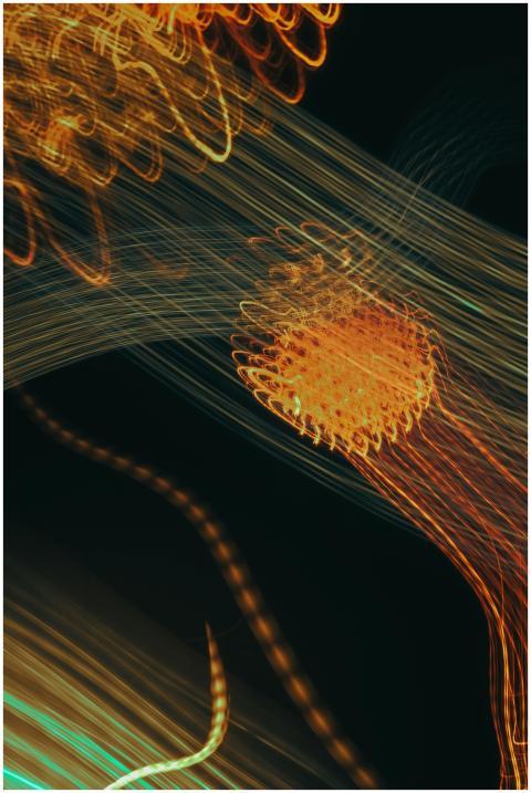 Dynamic abstract light trails creating vibrant pat