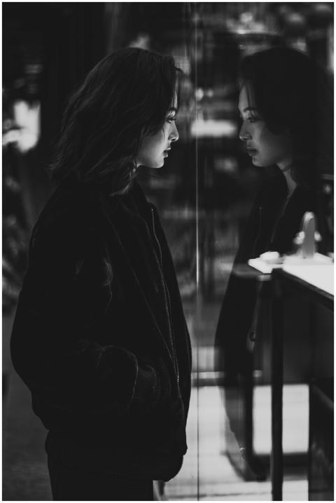 Black and white portrait of an Asian woman reflect