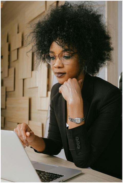 Professional woman with afro hairstyle working on