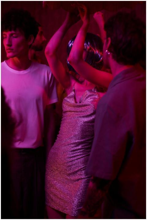 Energetic dance floor captured under neon lights,