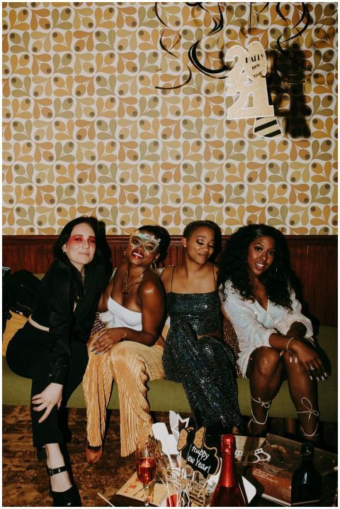 Group of friends celebrating New Year's Eve with f