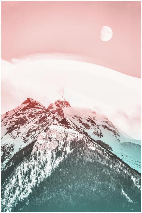 A serene snow-covered mountain range under a paste