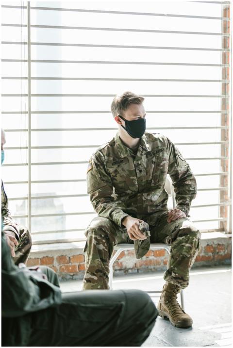 A therapy session with masked military personnel f