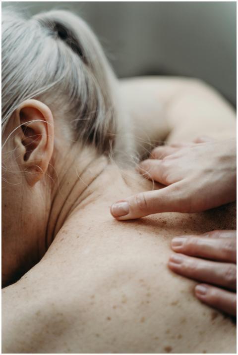Close-up of a shoulder massage showing gentle hand