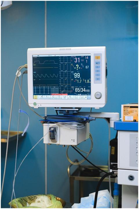 Close-up of a hospital monitor displaying vital si
